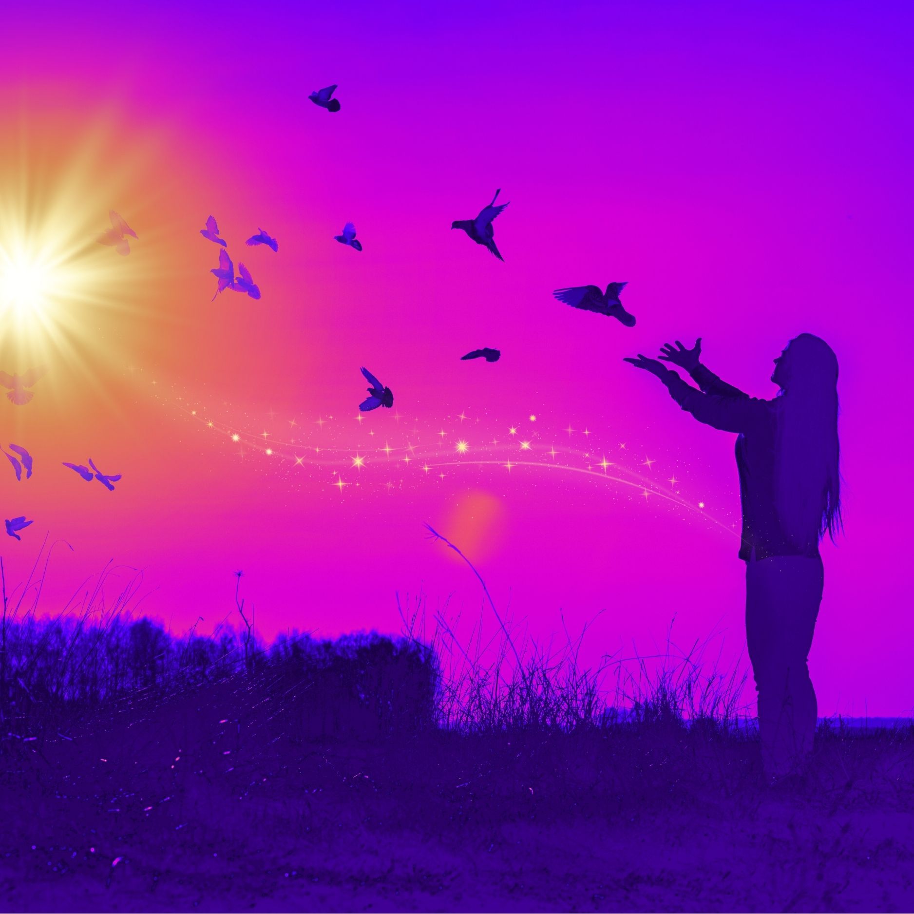 Rainbow coloured image with silhouette of woman releasing birds who fly towards the sun